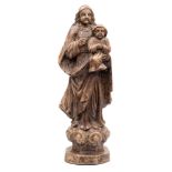 A 19th century Continental carved wood figure group of The Virgin Mary holding The Christ Child: