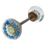 A pair of French glass spaced millefiori door handles: each with two concentric rings of flower