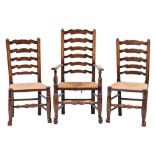 A harlequin set of eight early 19th Century elm and ash 'Wavy' ladderback dining chairs:,