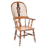 A Victorian elm and yew-wood stick back Windsor elbow chair:,
