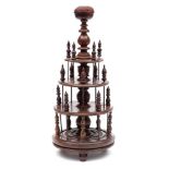 A 19th century rosewood bobbin stand: the central knopped column surmounted by a domed pin cushion,