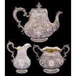 A Victorian silver three-piece tea service, maker Robert Hennell III, London, 1861: crested,