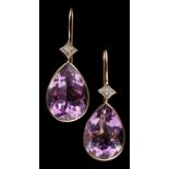 A pair of modern pear-shaped amethyst and diamond two-stone earrings: each pear-shaped amethyst