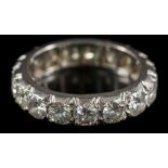 A 20th century diamond eternity ring: pave-set with seventeen round, brilliant-cut diamonds,