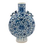 A Chinese blue and white moon flask: with chilong handles and painted overall with scrolling lotus,