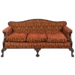 A carved mahogany settee in the Georgian taste:, upholstered to match the pair of open armchairs,