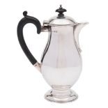 A George V silver hot water jug, maker RR, Birmingham, 1913: of plain baluster form,