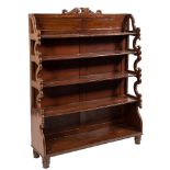A Victorian mahogany waterfall bookcase:, with panelled back,