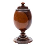 A 19th century turned lignum vitae cup and cover: of ovoid form, on knopped stem and circular base,