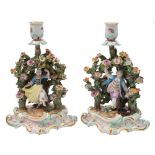A pair of Meissen figural candlesticks modelled after Ernst Leuteritz: in the form of a youth and a