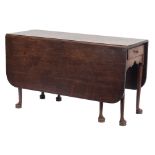 A mid 18th Century mahogany drop flap dining table:,