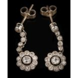 WITHDRAWN A pair of platinum and diamond pendant earrings: each with a circular cluster