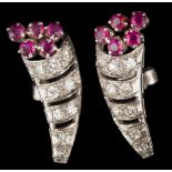 A pair of ruby and diamond cornucopia cluster earrings: each with a diamond-set horn with ruby