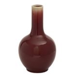 A Chinese 'sang-de-boeuf' bottle vase: the crackled glaze decorated in copper-red thinning at the
