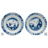 Two Chinese porcelain plates: each painted in blue with a mother and child beneath a willow tree