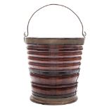 A 19th century Continental mahogany peat bucket: of coopered construction,