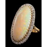 A large opal and diamond oval cluster ring: the central,