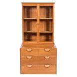 By John Makepeace A fruitwood display cabinet on a chest:,