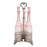 An Elkington and Co silver plated triple bottle stand: with three pierced cylindrical holders