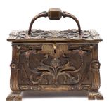 A Continental Art Nouveau period brass and copper casket: the hinged lid with loop carrying handle