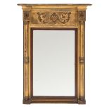 A Regency giltwood and gesso pier mirror:, the moulded cornice of recessed broken outline,