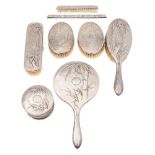 A Chinese silver eight-piece dressing table set, maker Luanc Seng: monogrammed,