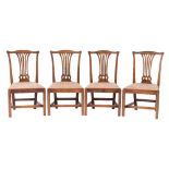 A set of four George III mahogany dining chairs:,