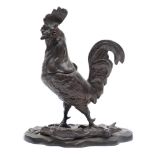 A late 19th century French bronze inkwell in the form of a cockerel: with inset glass eyes and