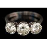 A graduated diamond three-stone ring: with round brilliant-cut diamonds estimated to weigh 0.