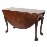 A mid 18th Century red walnut oval drop flap dining table:,
