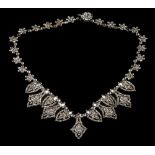 An early 19th century fringe necklace: composed of faceted steel rosette studs interspersed with