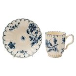 A Bovey Tracey blue and white creamware coffee cup and saucer: of reeded and fluted form with