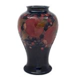 A Moorcroft baluster vase: decorated and tube lined in the Pomegranate pattern,