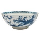 A First Period Worcester blue and white bowl: painted in 'The Precipice' pattern with pavilions in