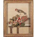 An early 19th century felt and needlework picture: depicting a chaffinch perched on an upturned