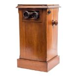 A Victorian mahogany table top stereoscopic viewer:, of typical form with turned handles,