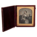 Richard Beard ,London , a daguerreotype portrait of a woman seated by a table,