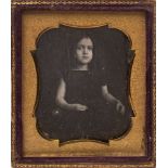 A Victorian daguerreotype portrait of a young girl with her hair in ringlets:, photographer unknown,