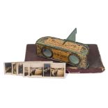 A tinplate Rotoscope 'Pocket Folding Stereoscope' in original box with a part set of 'Views of