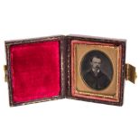 A 'postage stamp' size ambrotype portrait of a gentleman:,