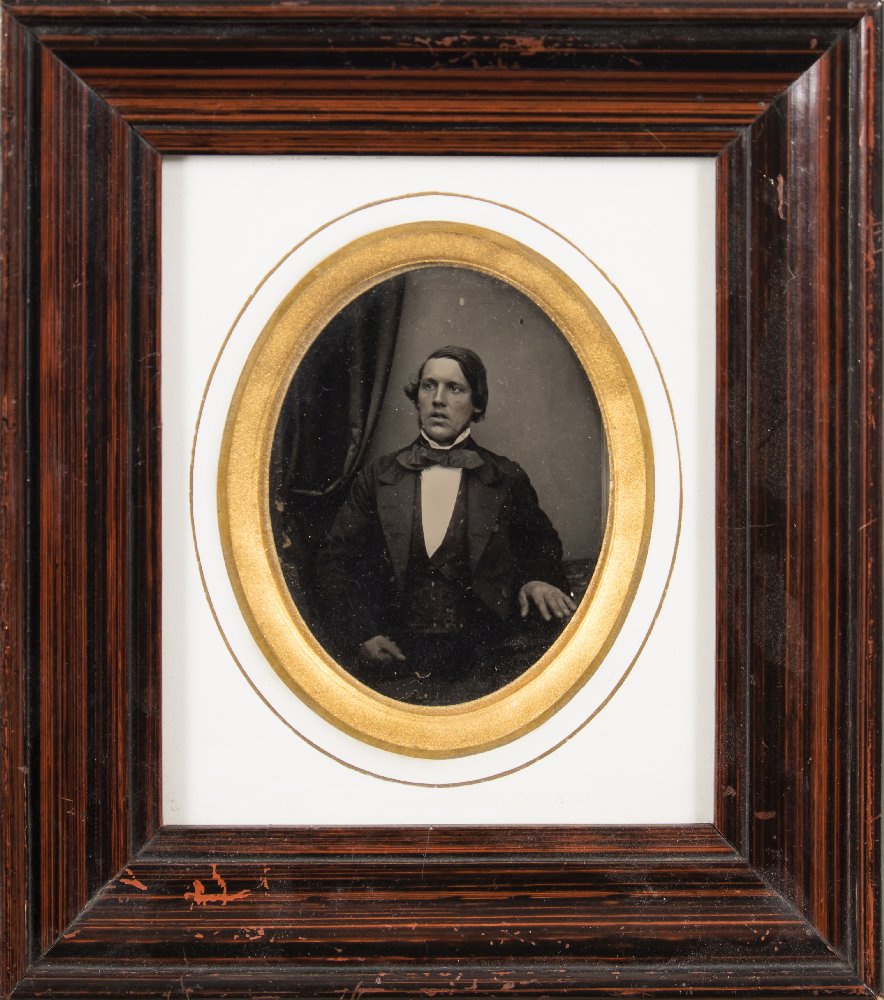 Photograph : a framed oval portrait of a seated man, mid-nineteenth century.