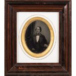 Photograph : a framed oval portrait of a seated man, mid-nineteenth century.
