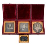 A family group of three daguerreotypes in red leather cases:,