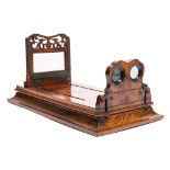 A Victorian walnut graphoscope:, the 6 1/4 inch magnifying lens over stereo cards viewers,