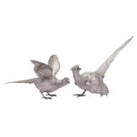 A pair of Continental silver models of a cock and hen pheasants,