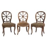 A set of nine 19th Century oak dining chairs in the Hepplewhite taste:,
