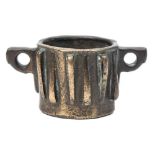 A Spanish octagonal bronze mortar: of small size with loop handles and twelve alternating