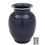 A Chinese blue-glazed monochrome vase: of ovoid form with flared rim,