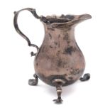 A George III silver cream jug, maker's mark worn, London, 1776: of baluster form with wavy edge rim,
