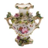 A mid 19th century English flower encrusted miniature two-handled vase: painted with floral